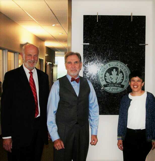 LEED certification plaque with Dean Frank Brown, U of U President Michael Young, and Dr. Marjorie Chan (2009).